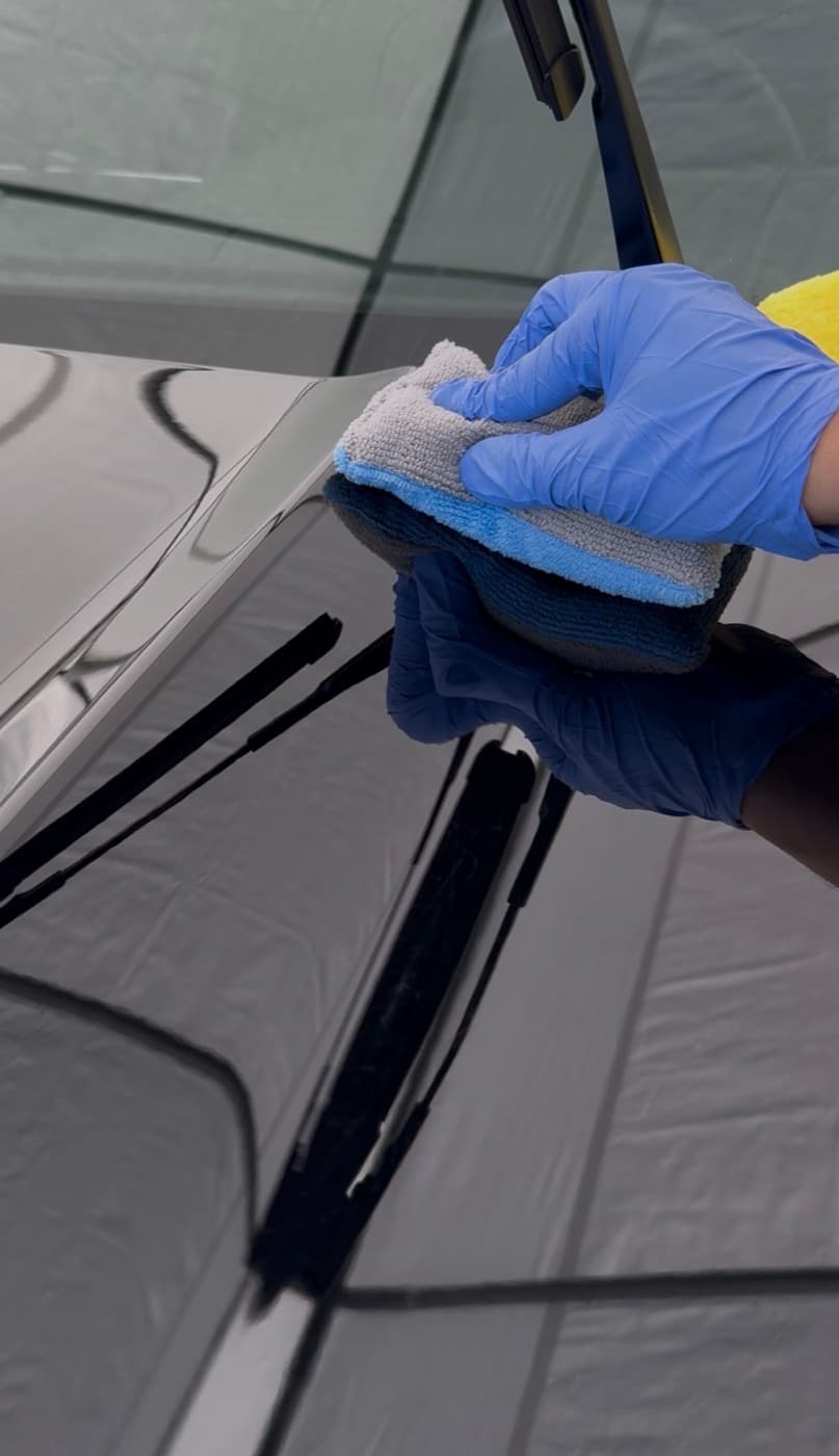 Panel wipe before coating a black hood