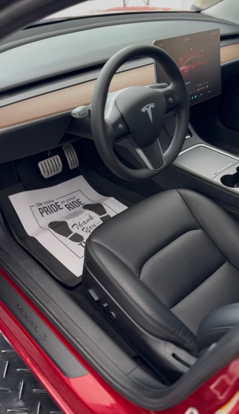 Tesla Model 3 interior with fresh floor mats